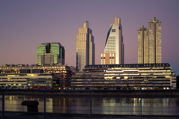 Fototapeta na wymiar Sunset with buildings in background, Puerto Madero, Buenos Aires, Argentina.