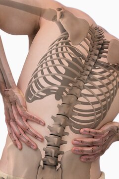 Digital composite of highlighted spine of man with back pain