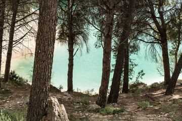 Naklejka na ściany i meble Nice view El Chorro Lake with turquoise green water and green trees on heels, daytime, landscape, Malaga, Spain.