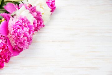 Peonies on a wooden table