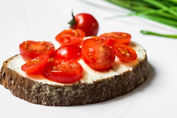 One sliced bread with cherry tomato.