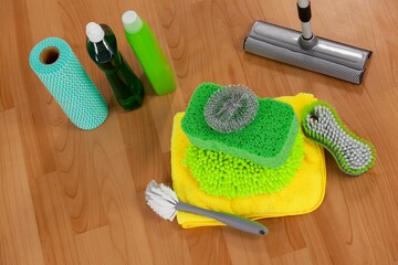 Various cleaning equipment on wooden floor
