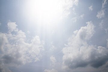 Lighting of sun on blue sky with white cloud.