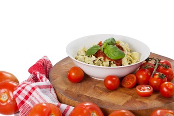 Fettuccine pasta with tomatoes, garlic and napkin cloth