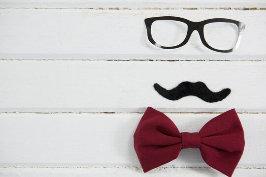 Close up of eyeglasses and bow tie 