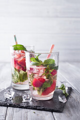 Glasses of lemonade with strawberries