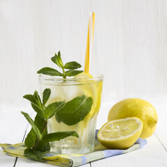Fototapeta premium Detox water with lemon and fresh mint leaves. Healthy lifestyle