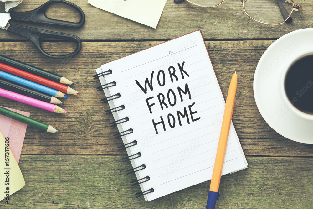 Poster work from home text written on notepad