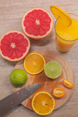 Citrus fruits with juice top view