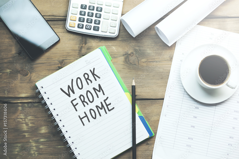 Poster work from home text written on notepad