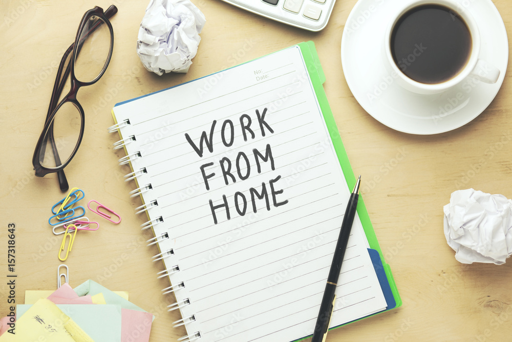 Poster work from home text written on notepad