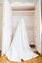 The perfect wedding dress with a full skirt on a hanger