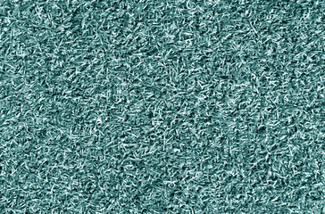 Cyan color decorative grass loan for sport and leisure.