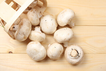 mushrooms on light wooden background. top view with copy space