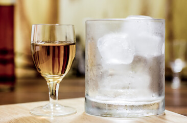 Whiskey shot glass and tumbler with ice