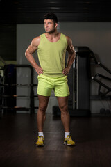 Fototapeta na wymiar Portrait of Muscle Man in Green T-shirt