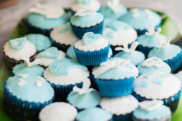 Muffines with blue and white decoration