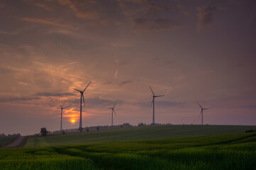 Fototapeta na wymiar Silhouette of wind turbine generating electricity on sunset