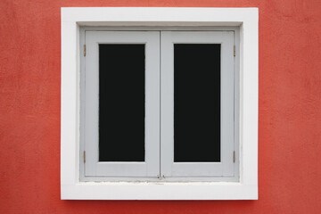 Wood windows white color with glass on cement wall orange color.