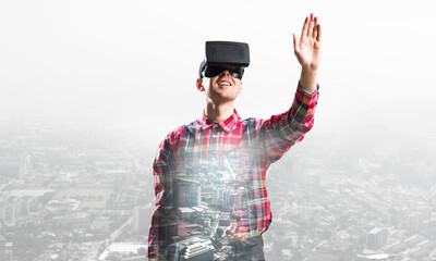 Guy wearing checked shirt and virtual mask stretching hand to touch something