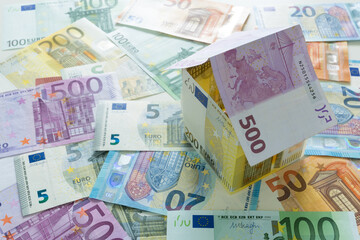 Fototapeta na wymiar Euro house on euro banknotes background