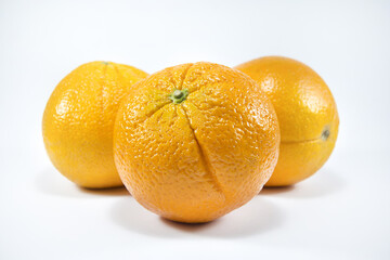 Fresh oranges isolated on white background. Freshly picked oranges. Close up.