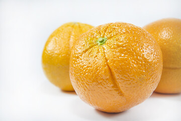 Fresh oranges isolated on white background. Freshly picked oranges. Close up.
