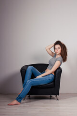 Portrait of young beautiful girl brunette in the Studio