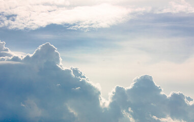 Amazing, fabulous sky, with fluffy clouds at sunset. Lots of fluffy clouds, like celestial mountains. heavenly cloud background..