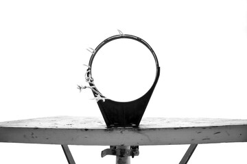 Looking up through tattered basketball hoop net. Isolated.