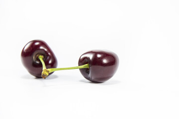 Cherry isolated on white background. Sweet ripe cherry. Beautiful read fresh cherry on a white background.