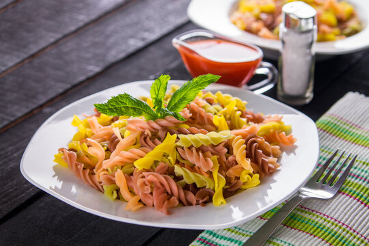 Colourful pasta with sauce