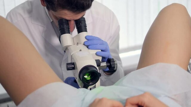 A prefessional doctor is examiming a girl's vagina.