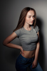 Portrait of young beautiful girl brunette in the Studio