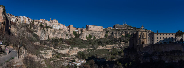 View to hanging houses of Cuenca old town. Outstanding example of a medieval city, built on the steep sides of a mountain. Many casas colgadas are built right up to the cliff edge. Cuenca, Spain