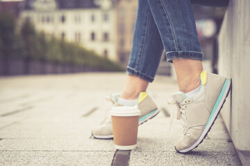 Abstract concept. Feet and cup of coffee