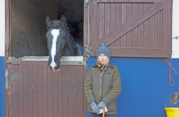 Girl and horse at stables