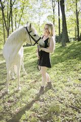 Portrait of Blond Female and White Horse