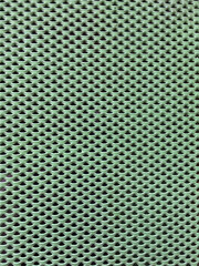 Pink Green metallic grid pattern closeup photo.