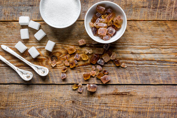 cooking sweets set with different sugar lumps on rustic table background top view mockup