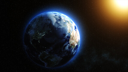 Sunrise over the Earth. Imaginary view of planet earth in outer space with the rising sun.