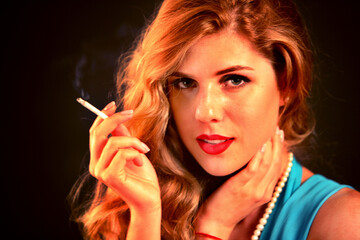 Obraz premium Woman smokes marijuana. Girl with seductive eyes who smokes cigarette. Smoke is bad habit. Nicotinic acid is harmful to health and female beauty.