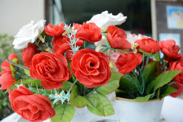 Bouquet of roses in pots with white table for valentines day