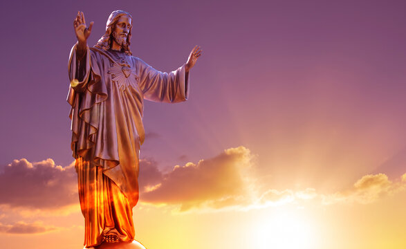 The Sacred Heart statues over dramatic sky