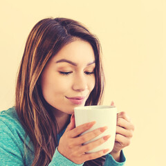 Young latina woman drinking coffee