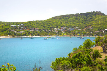 Antigua, Caribbean islands. English harbour view with Freeman’s bay and yachts anchored by the beach 