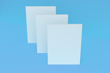 Three blank white closed brochure mock-up on blue background