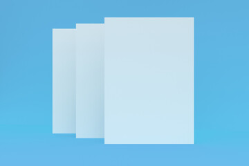 Three blank white closed brochure mock-up on blue background