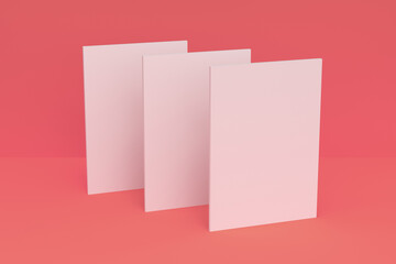 Three blank white closed brochure mock-up on red background