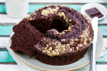 Chocolat bundt cake. Colorful wooden background.